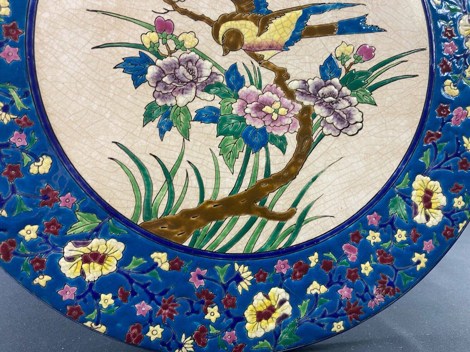 Large circular earthenware dish from Louvière with Longwy style bird decoration