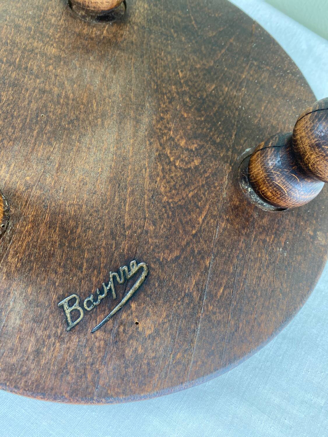 Signed turned wood tripod stool