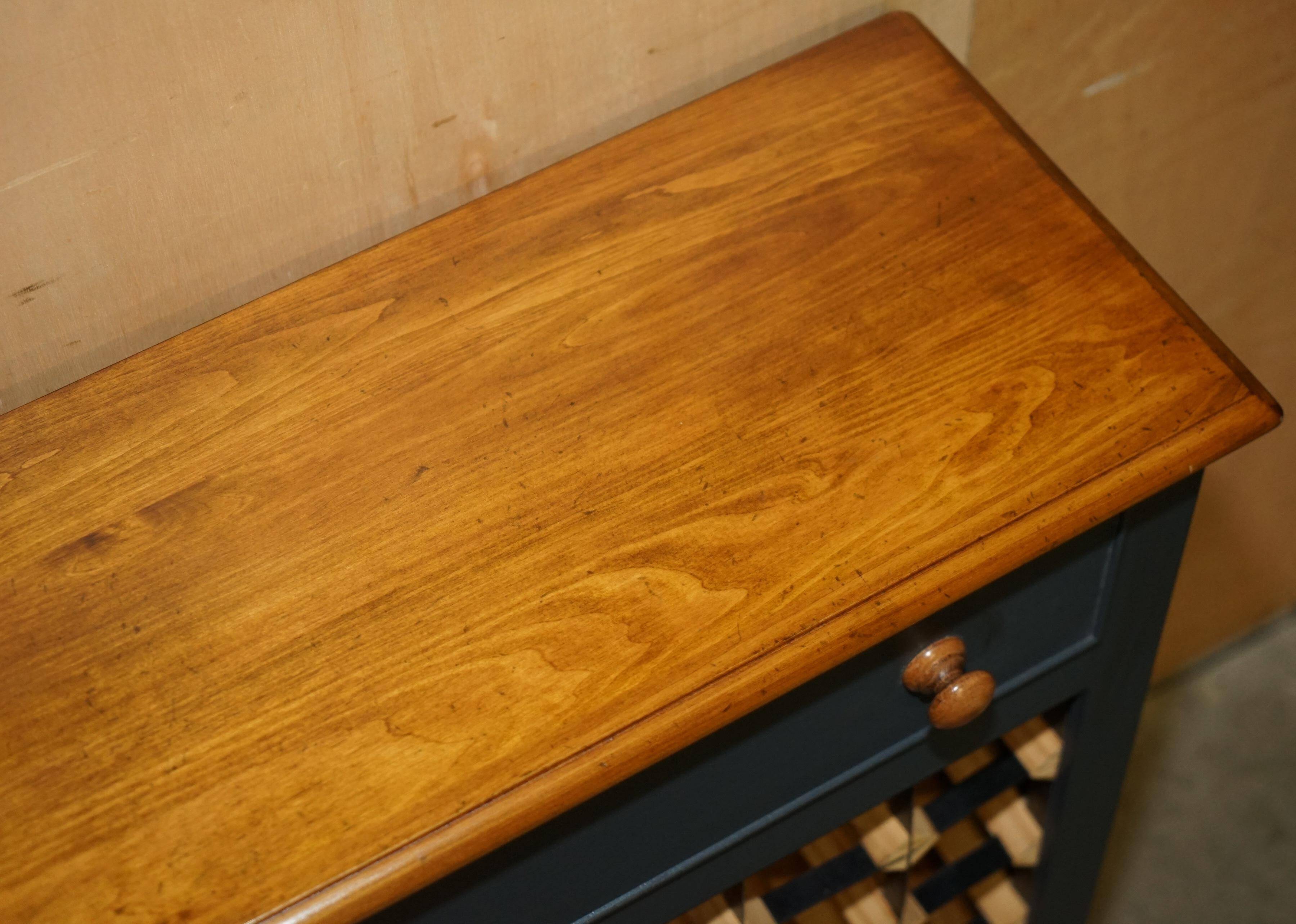 Vintage wine rack furniture for 36 bottles with drawer.