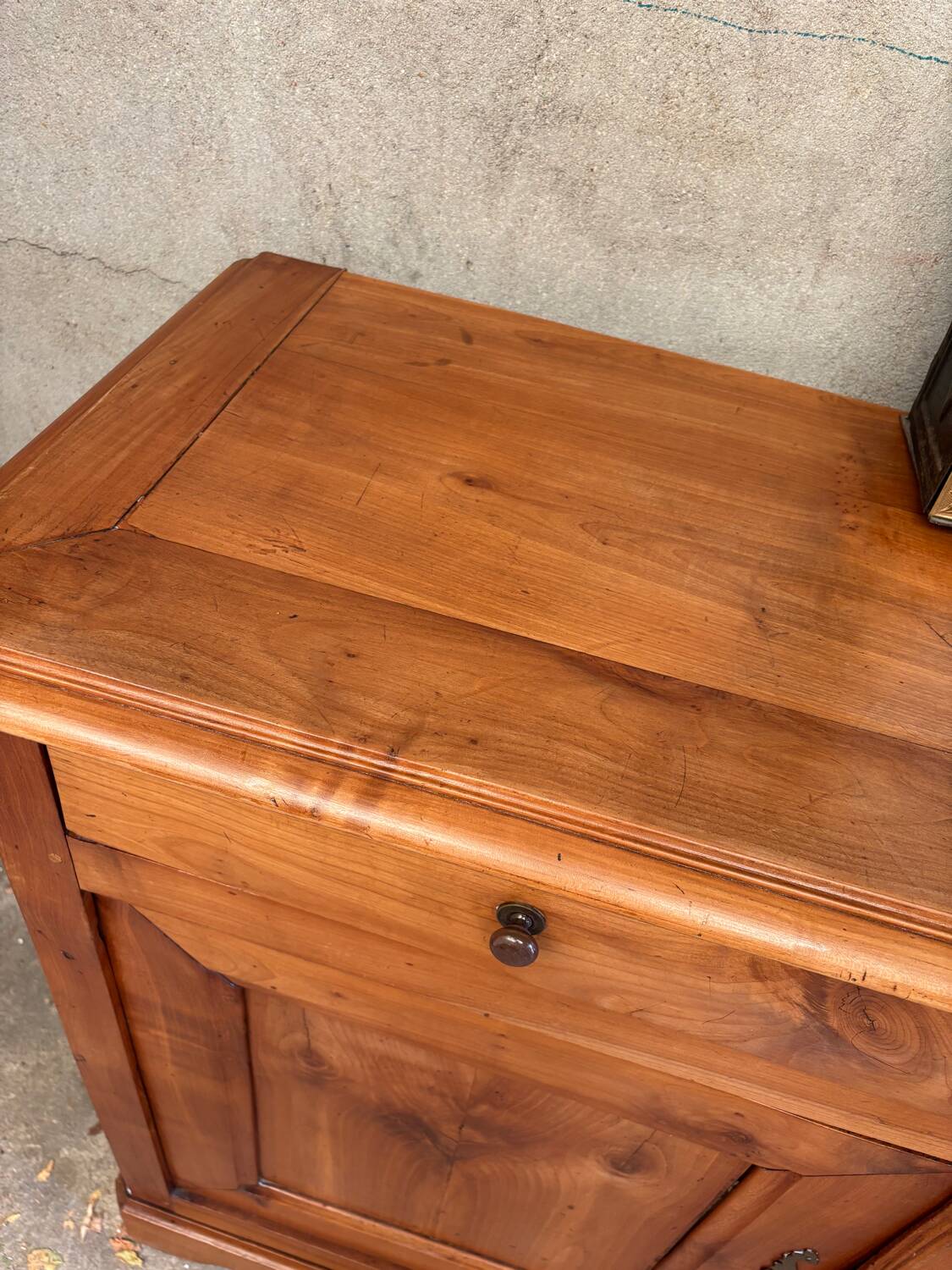 Small cherry wood sideboard in golden honey color