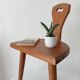 Low brutalist tripod chair in solid oak from the 1960s.