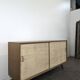Modernist sideboard in oak with rattan doors.