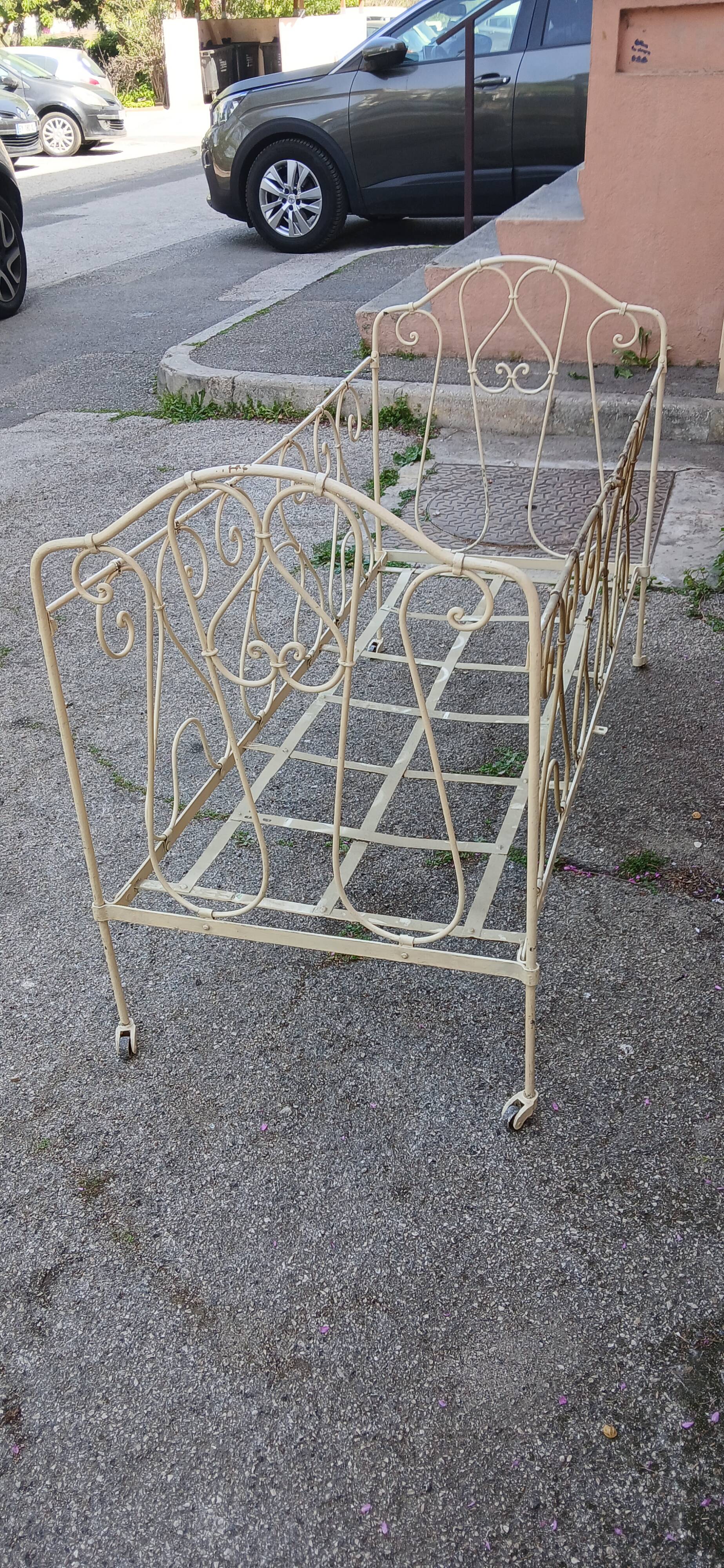 Magnificent bench/antique wrought iron bed.