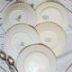 Old mismatched iron earthenware dessert plates accompanied by a dish