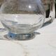 Vintage blown glass pitcher with bubbles, transparent.