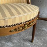 DeCoene antique wood writing desk with beige striped upholstered chair, brass-accented classic set