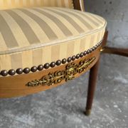 DeCoene antique wood writing desk with beige striped upholstered chair, brass-accented classic set