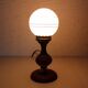 Turned wood and pink glass lamp