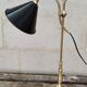 Old lamp in gilded bronze and brass with black enamel lampshade