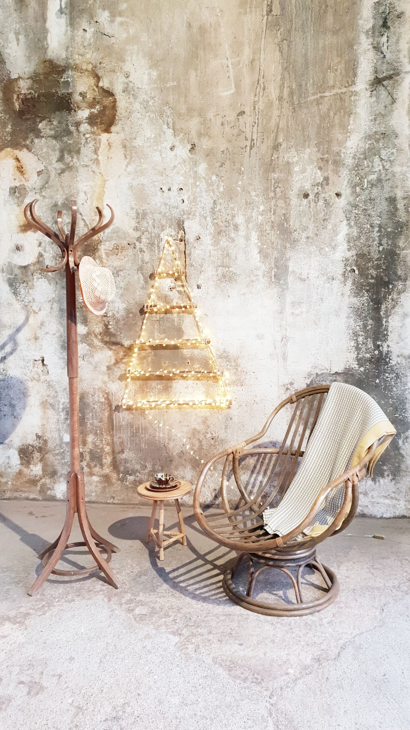 Antique swivel rattan armchair