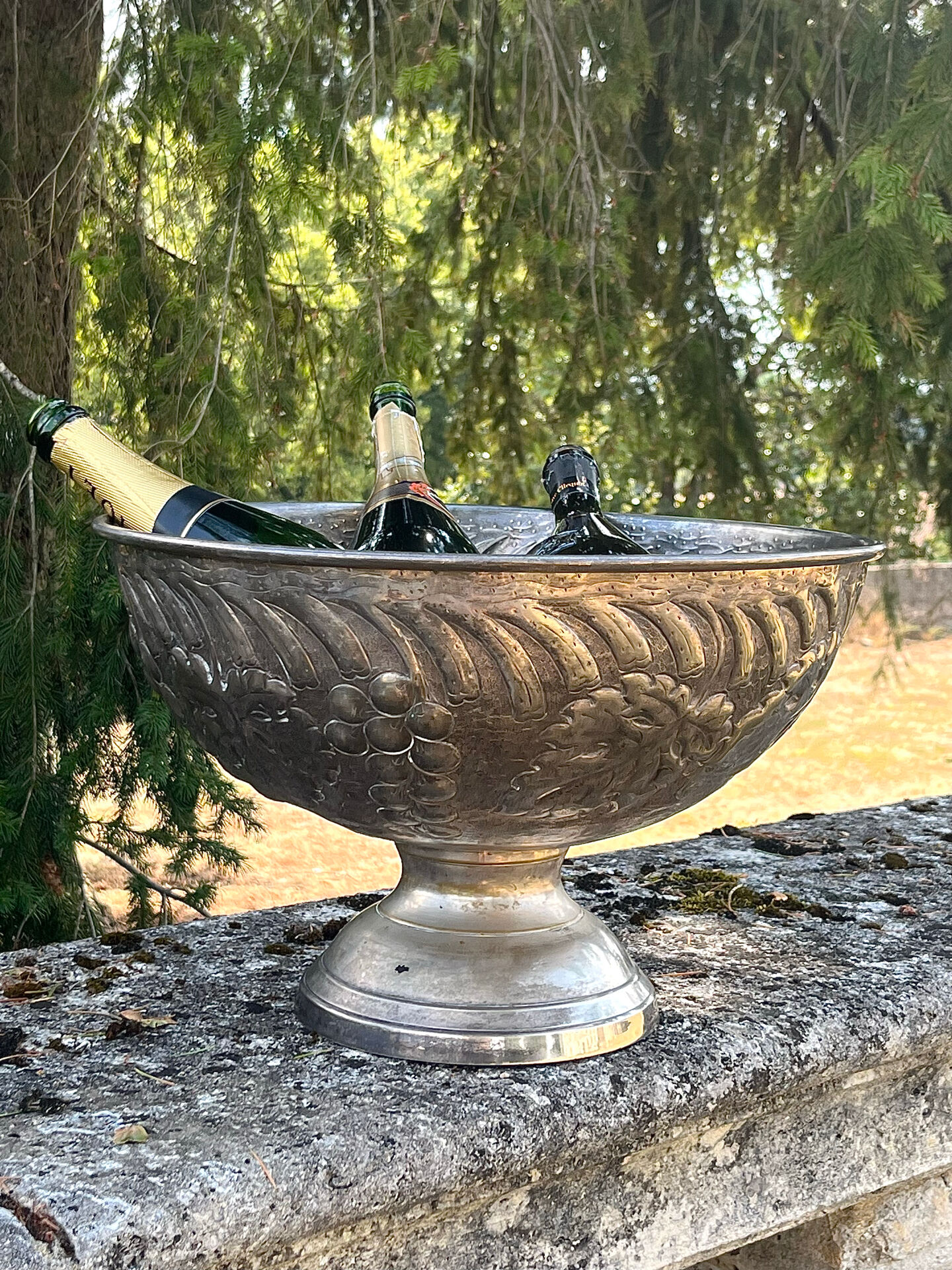 Large silver plated champagne cooler bowl on pedestal with grape