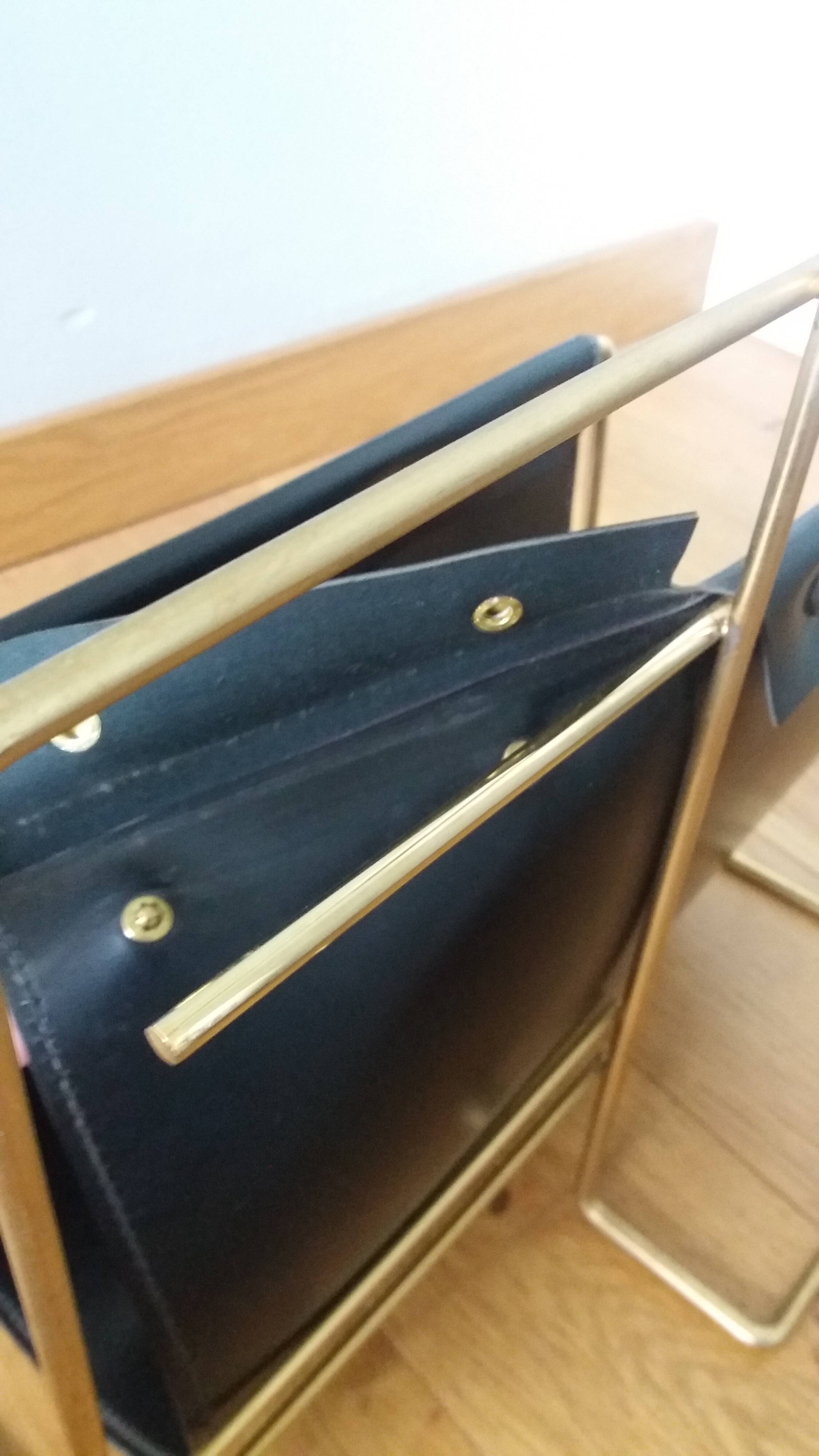 Modernist magazine rack in the style of Jacques Adnet