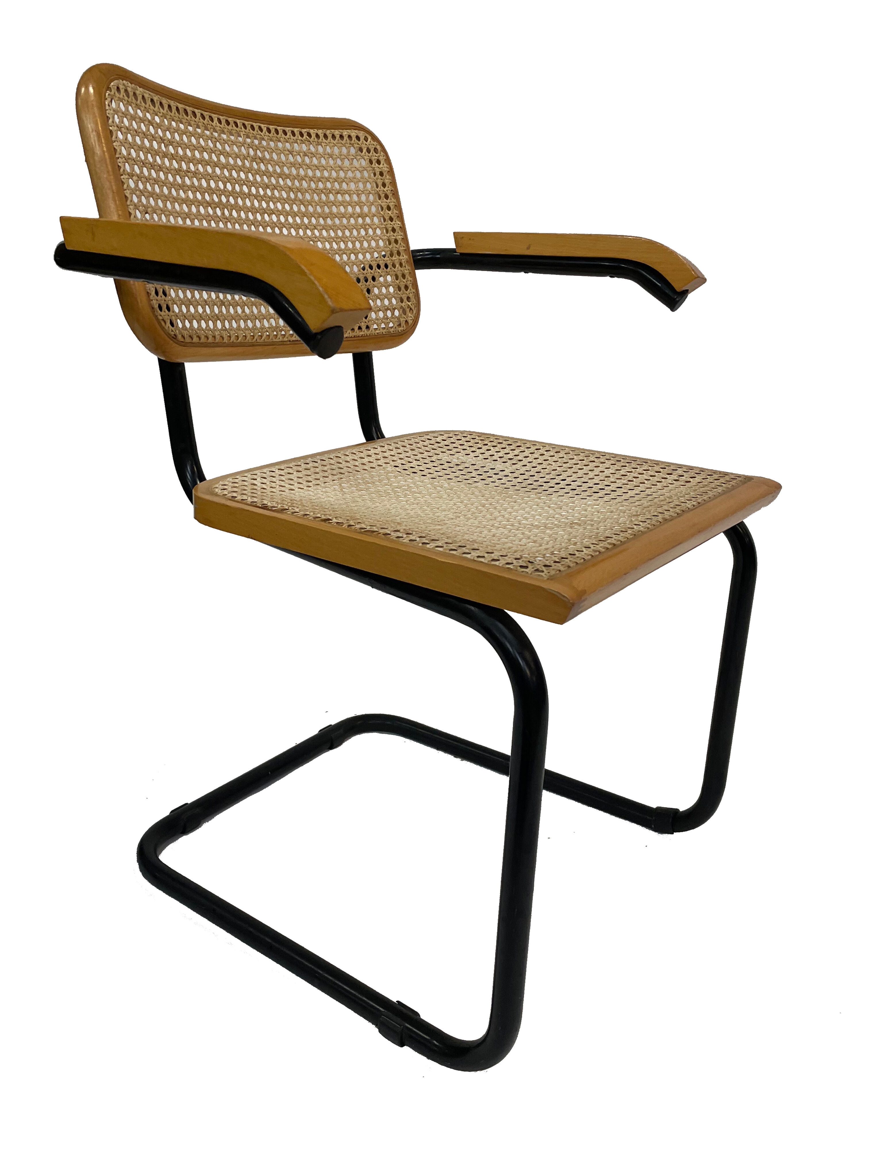 Cesca model chair designed by Marcel Breuer with black-framed armrests
