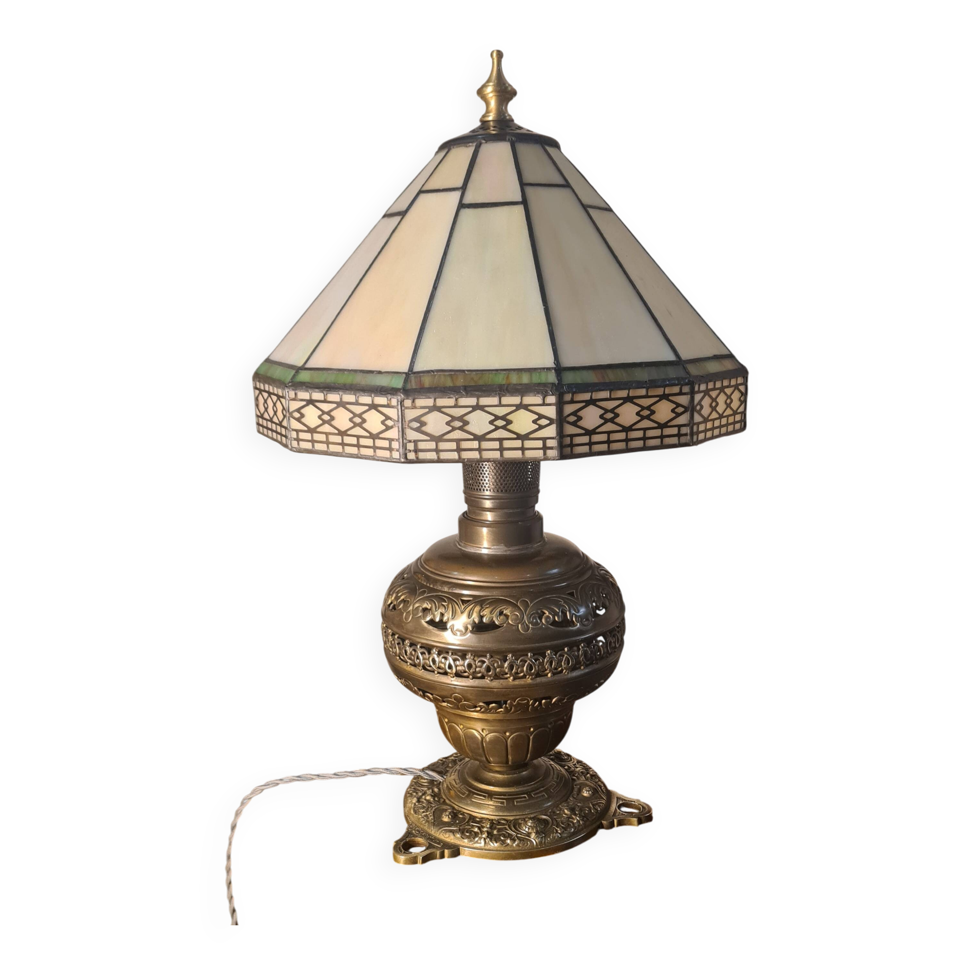 brass and bronze lamp with an antique base from 1900 and a glass paste shade