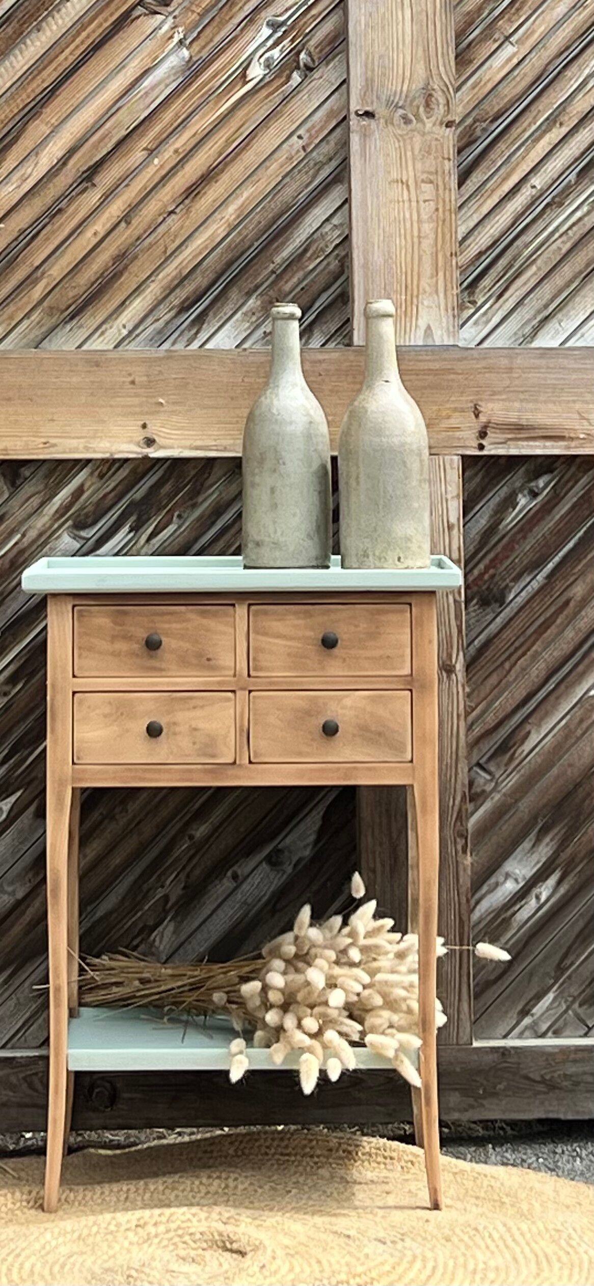 Raw wood console in water green with 4 drawers.