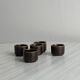 Set of 5 dark brown glazed ceramic egg cups.