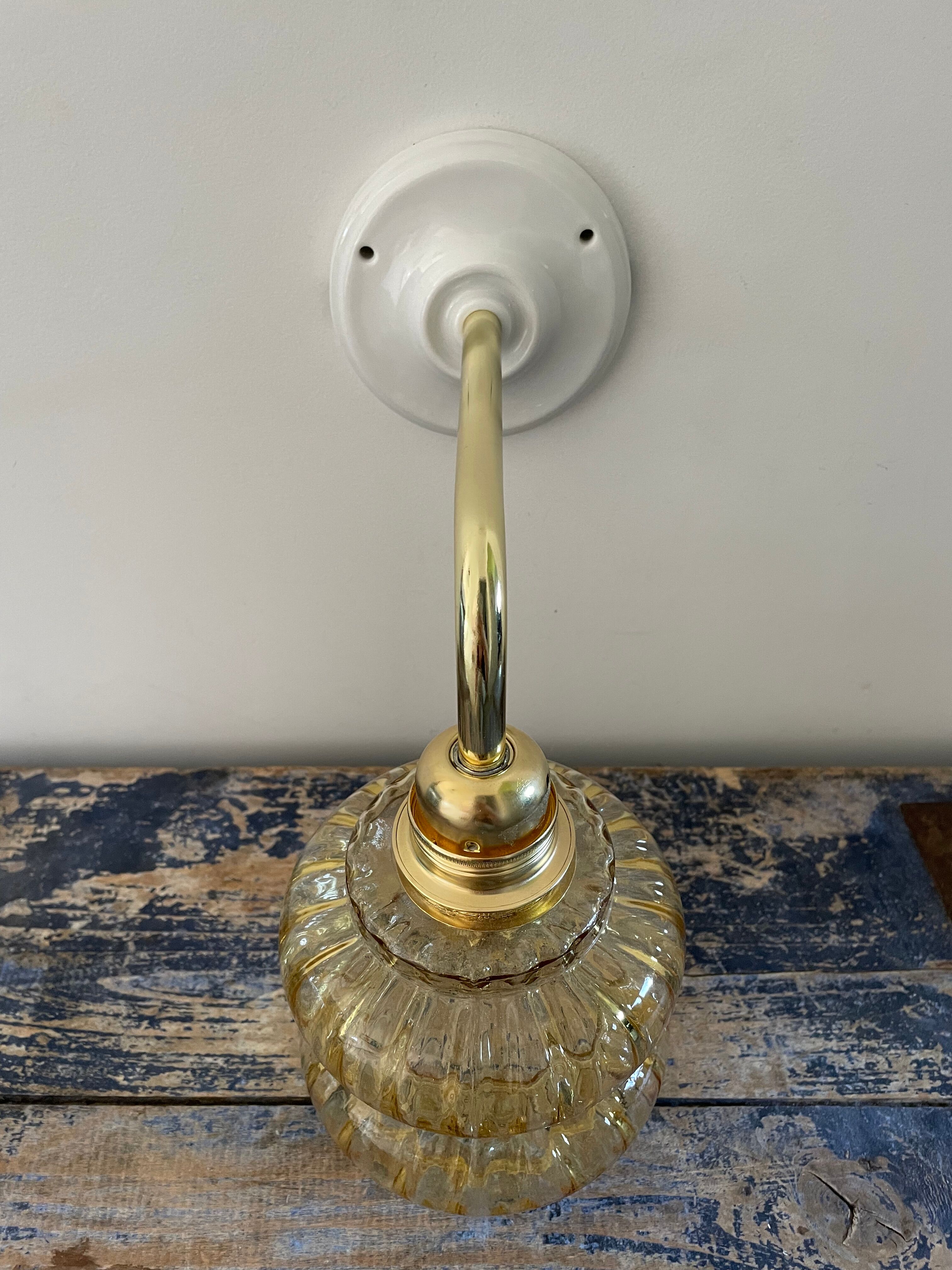 Vintage wall lamp in gilded chiseled glass