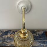 Vintage wall lamp in gilded chiseled glass