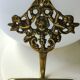 Decorative coat hook with cherubs/putti in aged brass.