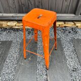 Orange metal workshop stool
