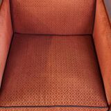 Art Deco design armchair with red fabric upholstery and wooden details