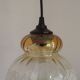 French vintage amber and clear glass ceiling light with white floral decoration.