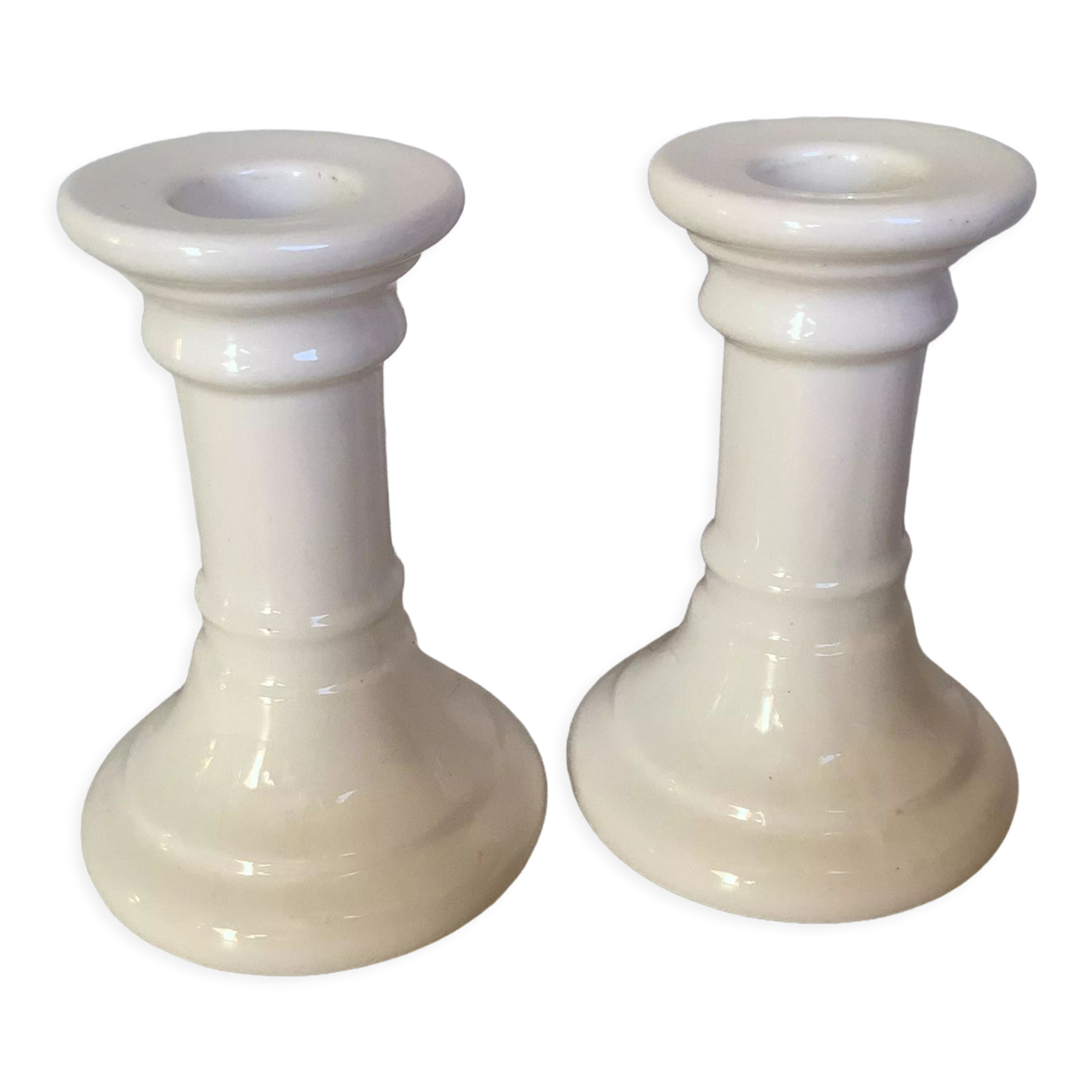 Pair of white earthenware candle holders