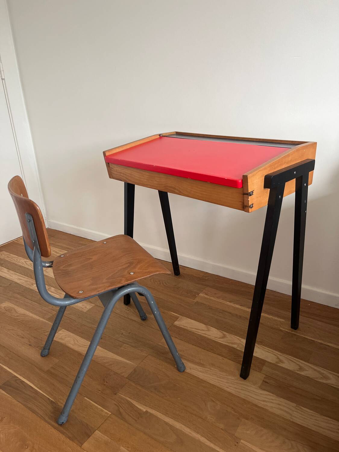 Vintage 1960s school desk with a red Formica top.