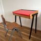 Vintage 1960s school desk with a red Formica top.
