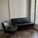 Sofa and armchair in Swedish black leather by Gunilla Allard for Lammhults.