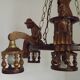 French vintage Breton chandelier with hand-carved figures, well, and lantern lights.