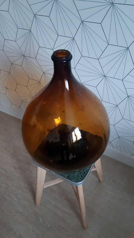 Great old demijohn in amber glass