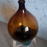 Great old demijohn in amber glass