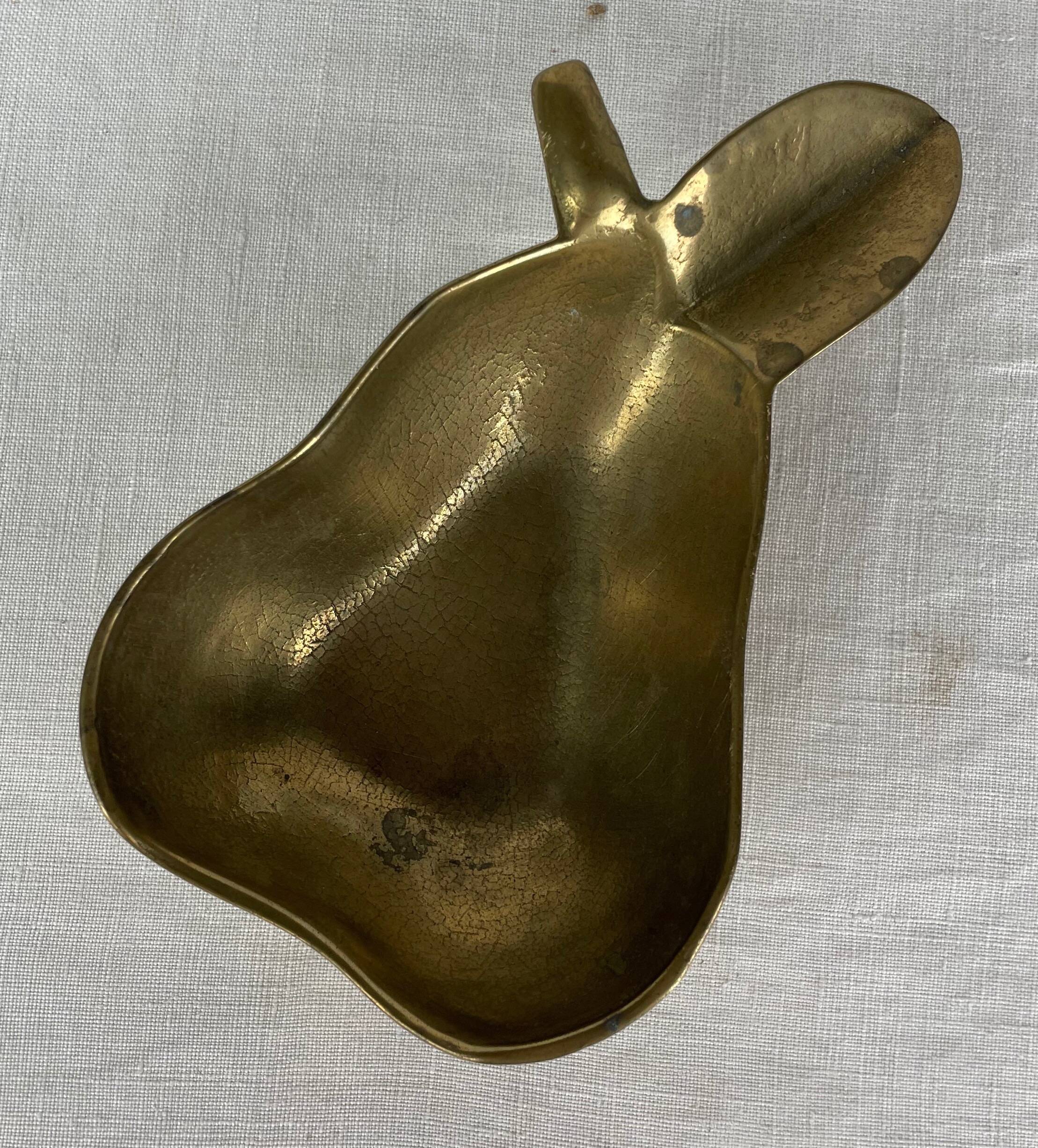 Empty pocket ashtray in pear-shaped brass
