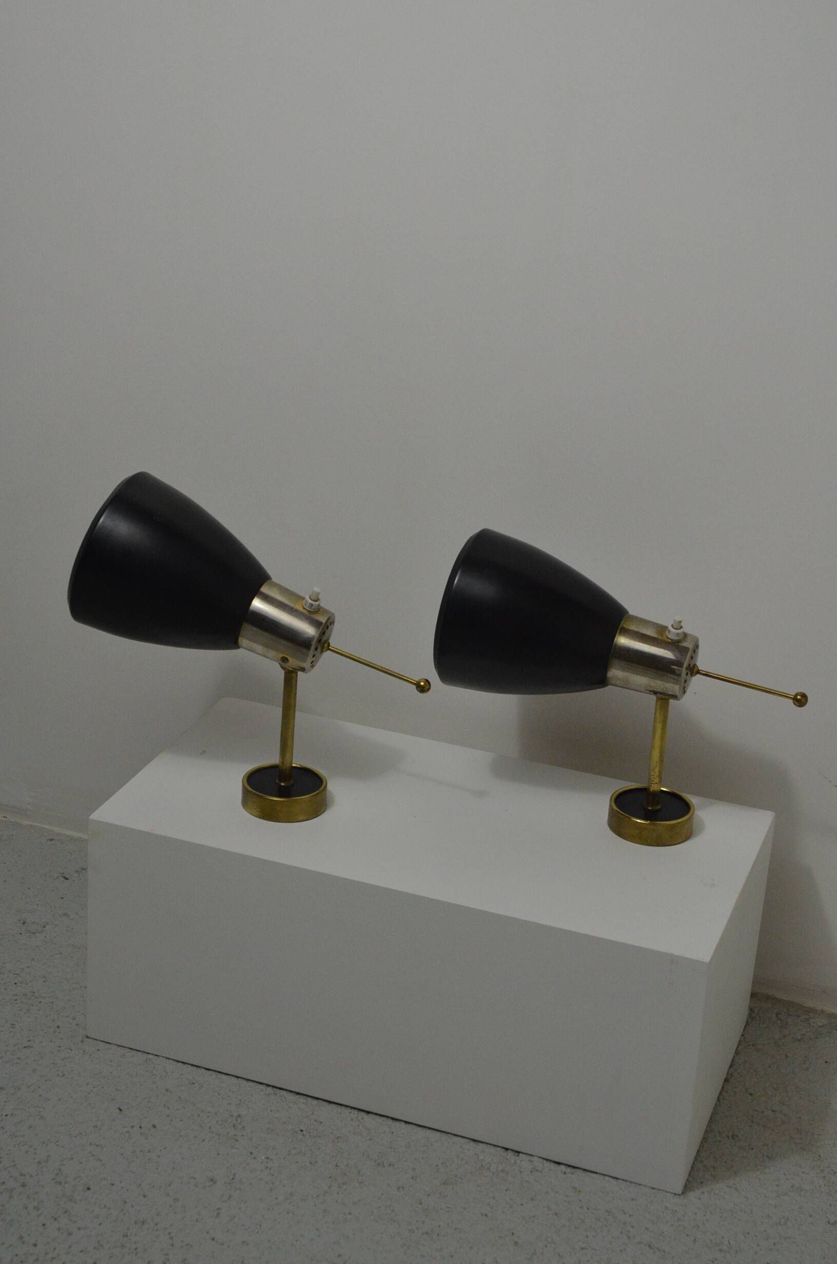 Pair of Monix wall lights in black lacquered metal and brass