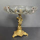 Antique crystal bowl on a bronze stand.