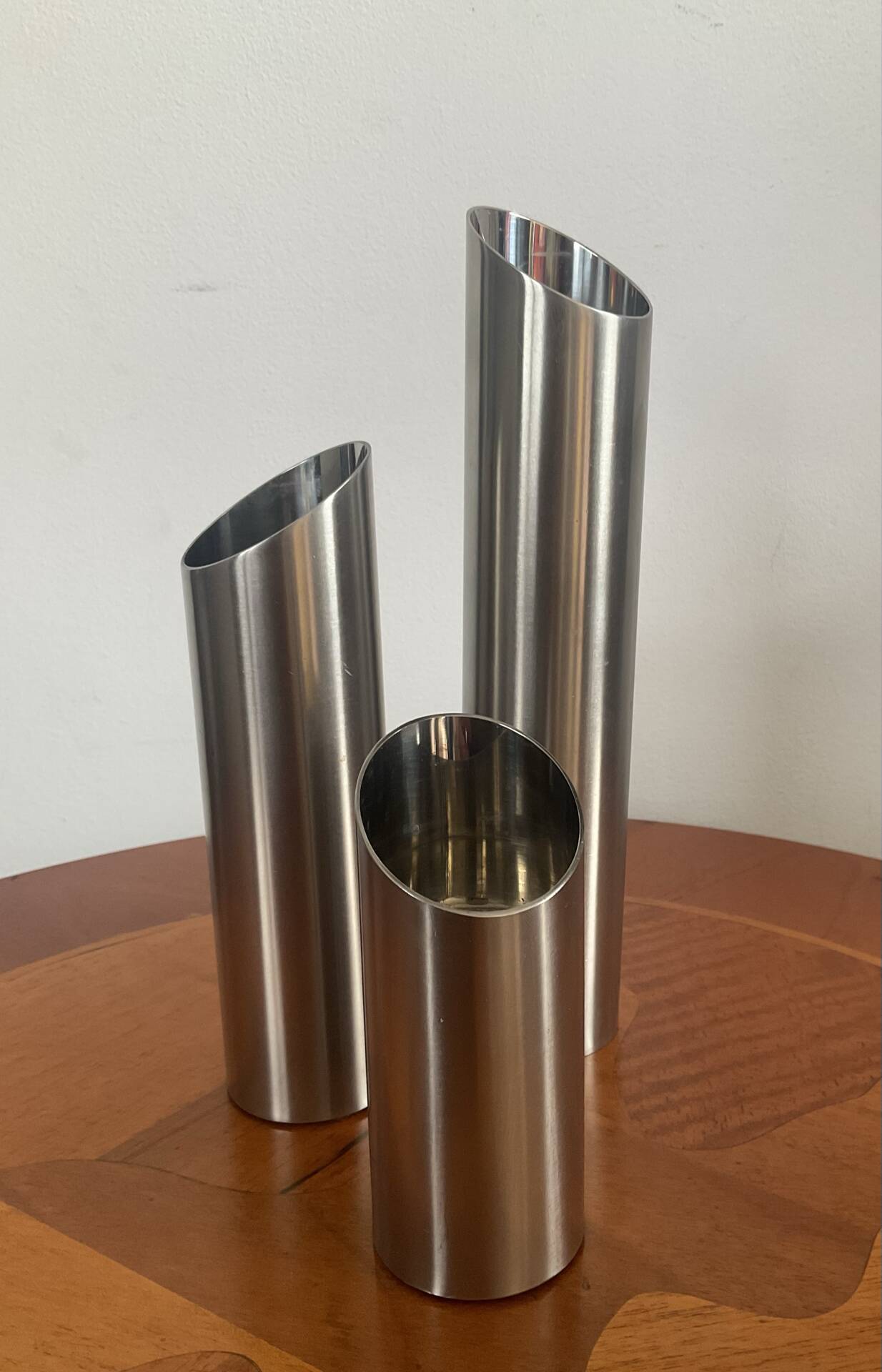 Vintage trio of brushed stainless steel candle holders