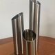 Vintage trio of brushed stainless steel candle holders
