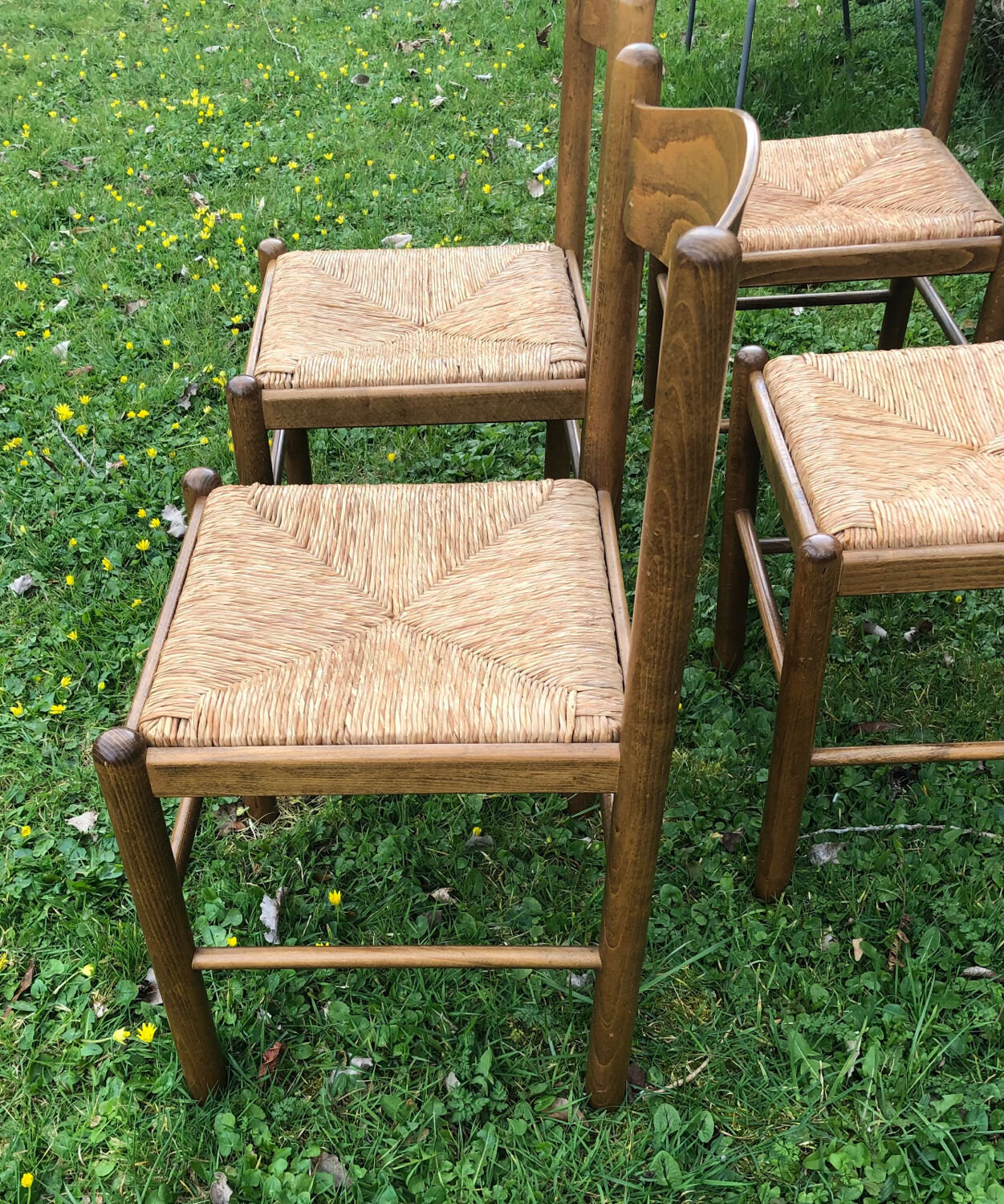 4 wood and straw chairs