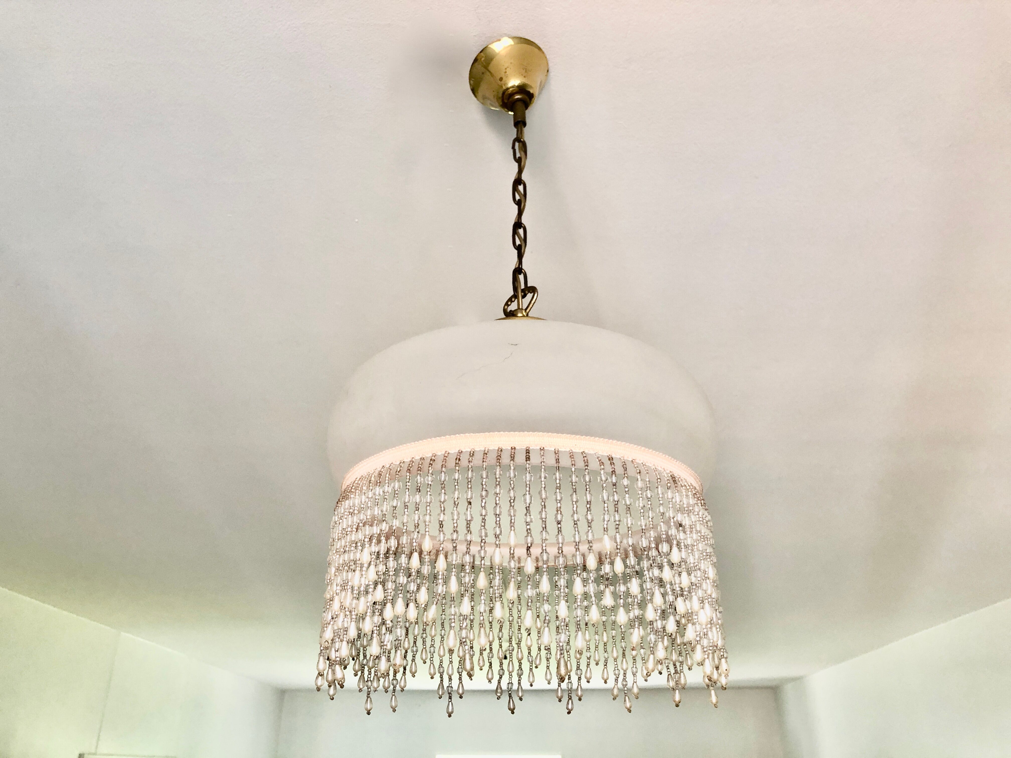 Pink half-shell suspension with pearl fringe