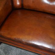 Victorian Chesterfield leather canapé with oak lion claw feet.