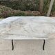 Table de bistrot marbre ovale et acier noir 4 couverts 120cm