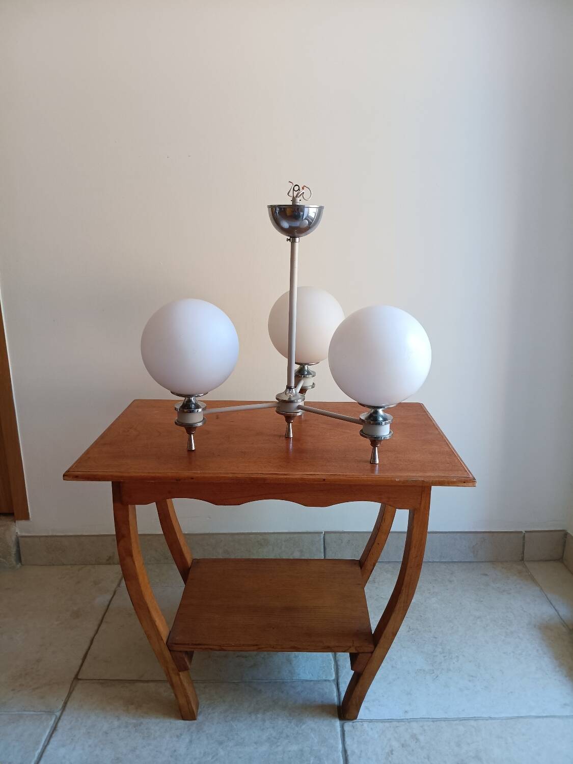 White ball and metal chandelier