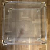 2 side tables in plexiglass, glass, and brass.