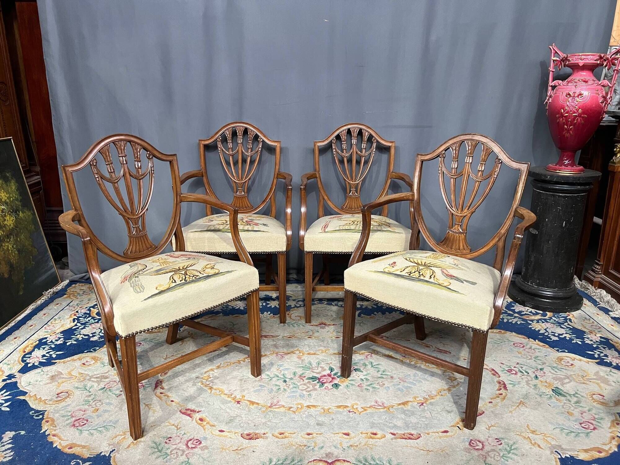 Set of four Sheraton-style armchairs. Solid walnut.