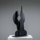 Abstract multilayered wooden sculpture with geometric shapes