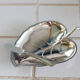 Silver metal butter dish with leaf pattern