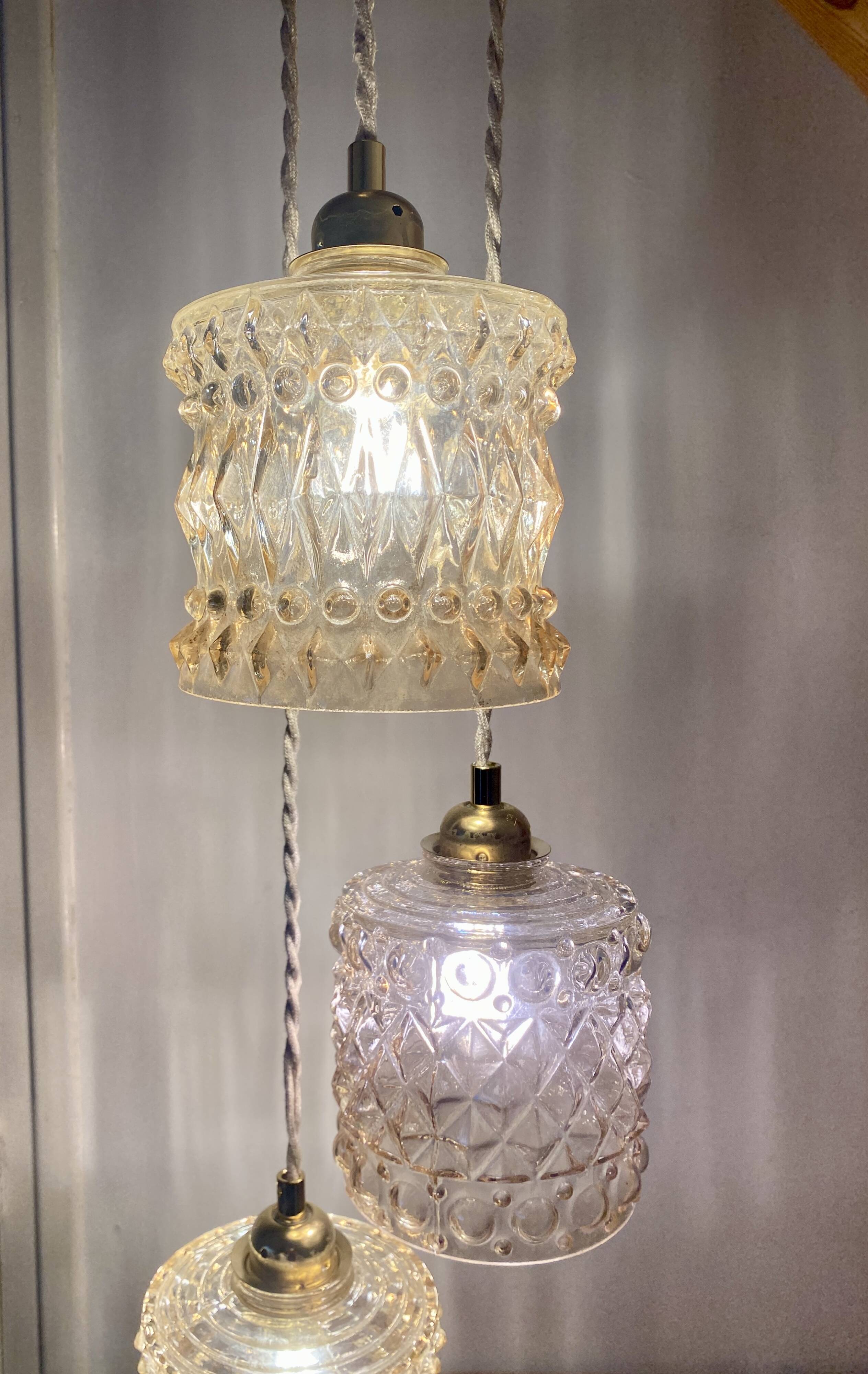 Triple antique globe pendant light in amber glass