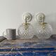 Set of two new electrified chiseled glass globe sconces
