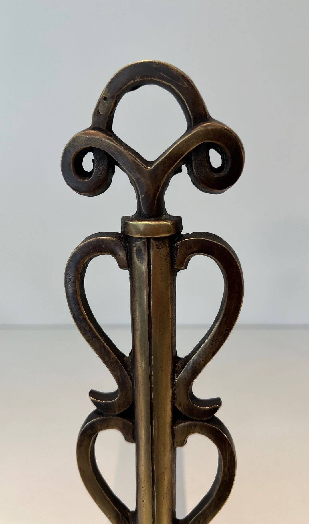 Pair of Brass and Wrought Iron Chenets with Scroll Columns and Arched Bases